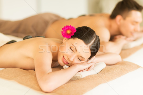 couple in spa with hot stones Stock photo © dolgachov