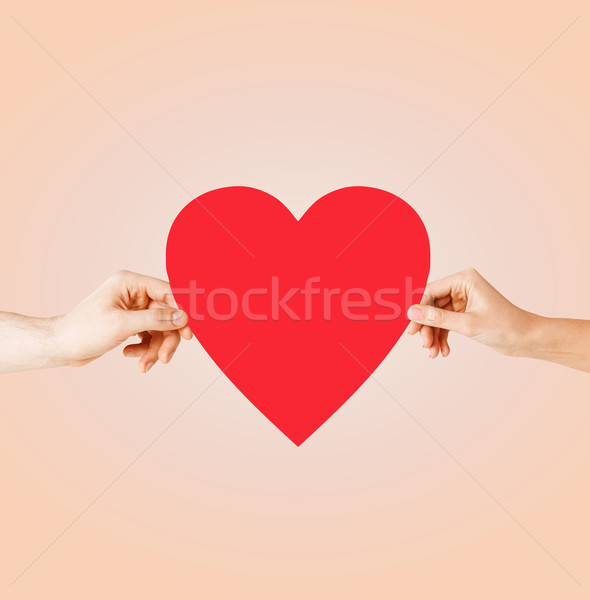 Coppia mani rosso cuore salute Foto d'archivio © dolgachov