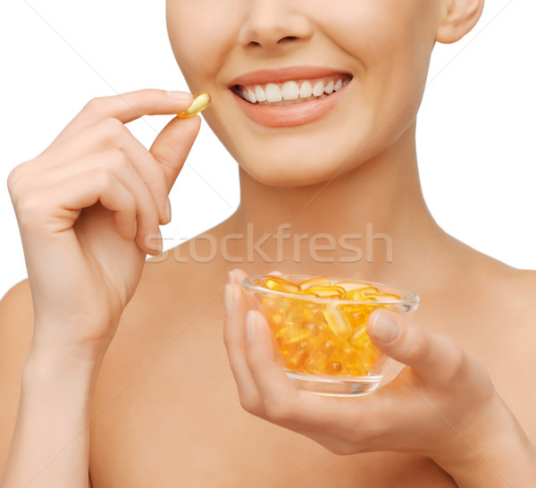 Mooie vrouw omega 3 vitaminen gezondheidszorg schoonheid vrouw Stockfoto © dolgachov