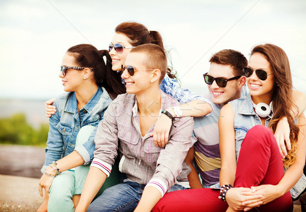 group of teenagers hanging out Stock photo © dolgachov