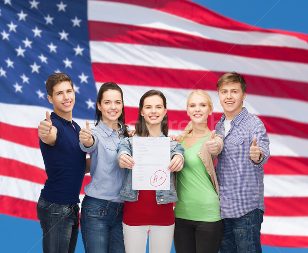 group of students showing test and thumbs up Stock photo © dolgachov