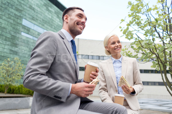 Stock photo: smiling businessmen with paper cups outdoors