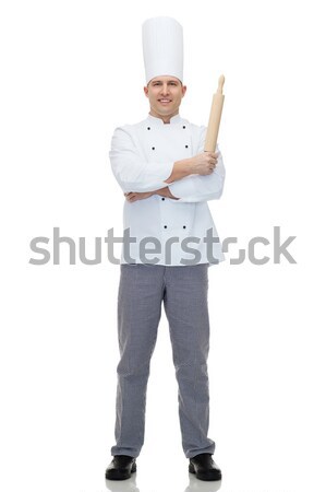 happy male chef cook holding rolling pin Stock photo © dolgachov