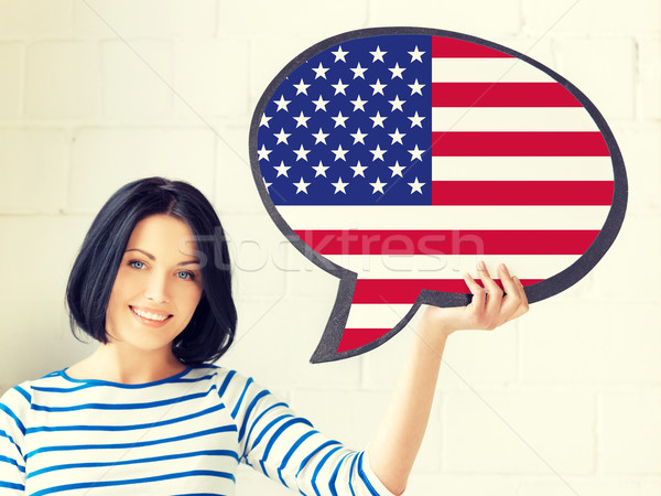 Stockfoto: Glimlachende · vrouw · tekst · bubble · Amerikaanse · vlag · onderwijs · buitenlands