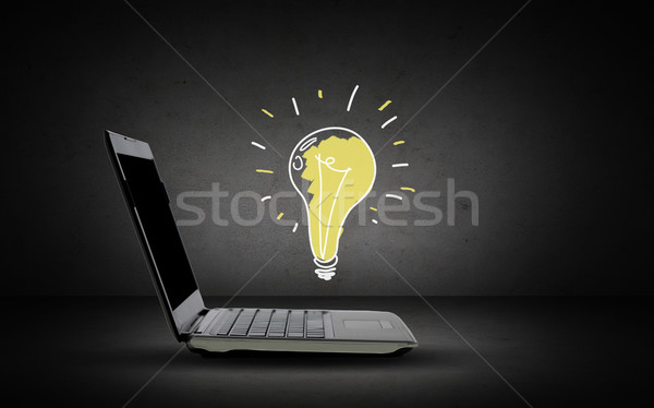 open laptop computer with lighting bulb doodle Stock photo © dolgachov