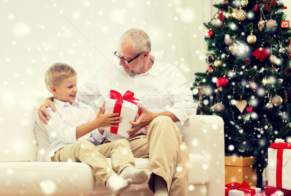 smiling grandfather and grandson at home Stock photo © dolgachov