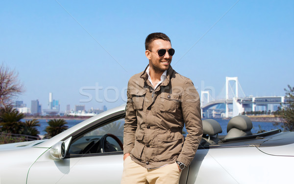 happy man near cabriolet car outdoors Stock photo © dolgachov