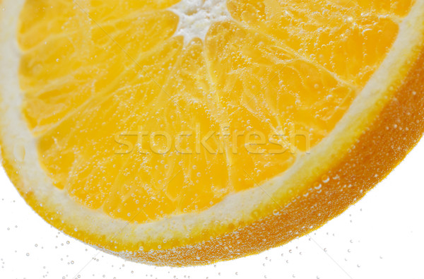 orange slice falling or dipping in water  Stock photo © dolgachov