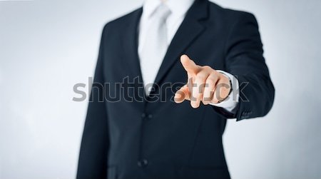 close up of man pointing finger to something Stock photo © dolgachov