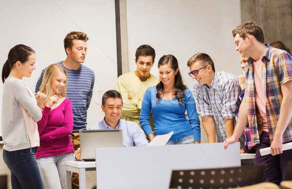 group of students and teacher with laptop Stock photo © dolgachov