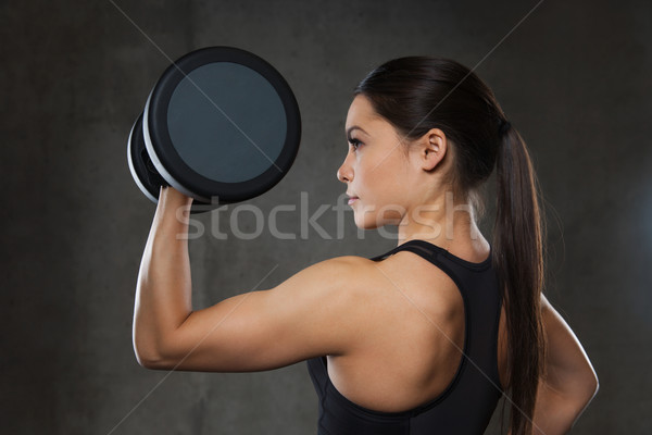 Músculos pesas gimnasio fitness deporte Foto stock © dolgachov