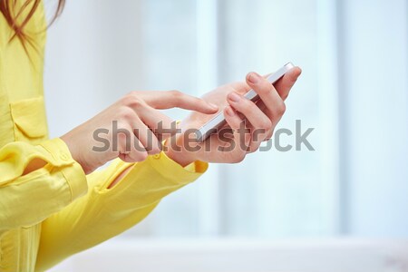 close up of woman texting on smartphone at home Stock photo © dolgachov