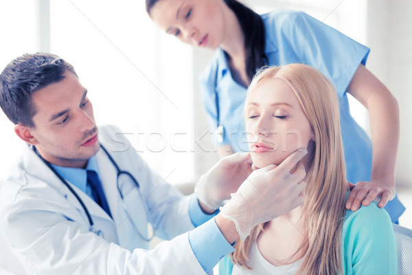male plastic surgeon with patient Stock photo © dolgachov