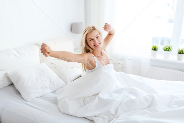 年輕女子 床 家 臥室 睡眠 商業照片 © dolgachov