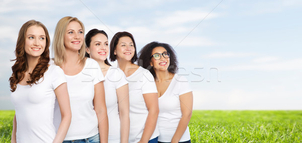 group of happy different women in white t-shirts Stock photo © dolgachov