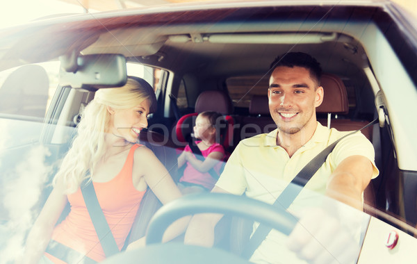 happy family with little child driving in car Stock photo © dolgachov