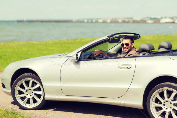 Boldog férfi vezetés cabrio autó kint Stock fotó © dolgachov