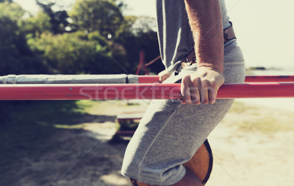 Jeune homme parallèle bars extérieur fitness [[stock_photo]] © dolgachov