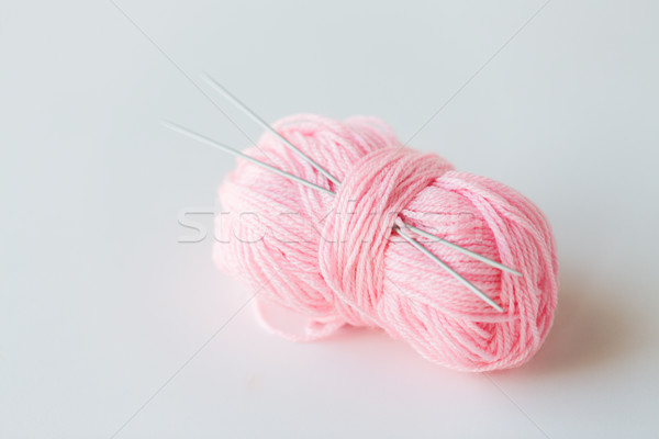 knitting needles and ball of pink yarn Stock photo © dolgachov