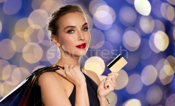 woman with credit card and shopping bags Stock photo © dolgachov