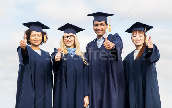 Fericit studenţi burlaci educaţie Imagine de stoc © dolgachov