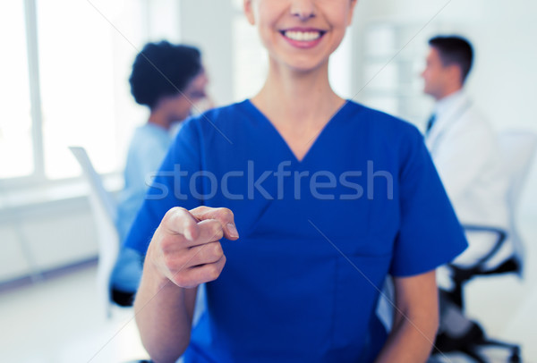 Stock photo: close up of nurse pointing on you at hospital