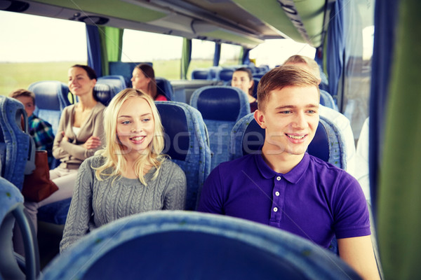 happy couple or passengers in travel bus Stock photo © dolgachov