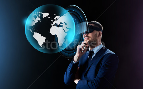 businessman in virtual reality headset over black Stock photo © dolgachov