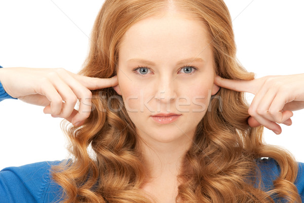 woman with fingers in ears Stock photo © dolgachov