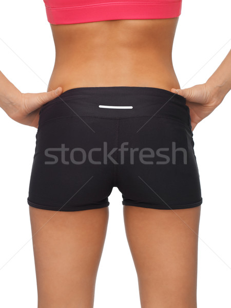 woman's sporty buttocks Stock photo © dolgachov