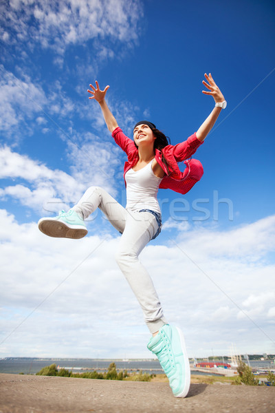 beautiful dancing girl jumping Stock photo © dolgachov