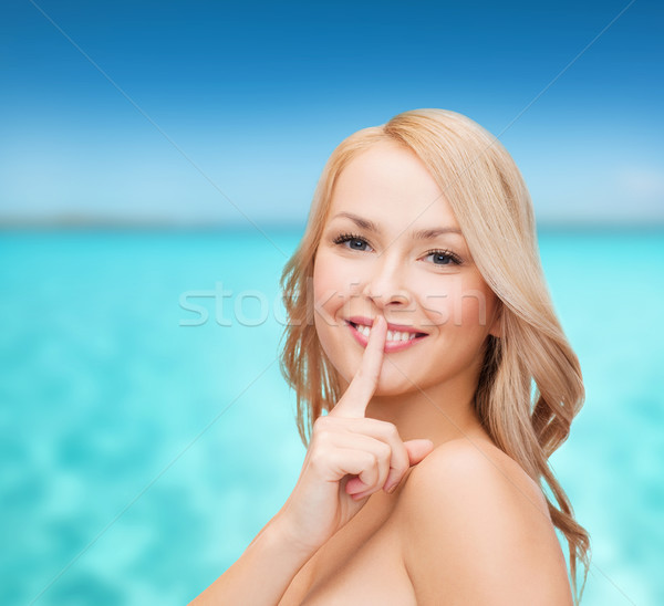 Gyönyörű fiatal nő mutat ujj ajkak egészség Stock fotó © dolgachov