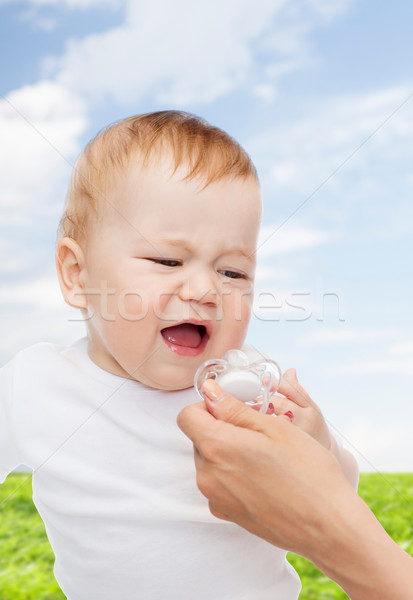 crying baby with dummy Stock photo © dolgachov