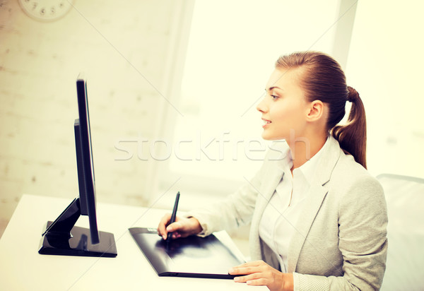businesswoman with drawing tablet in office Stock photo © dolgachov