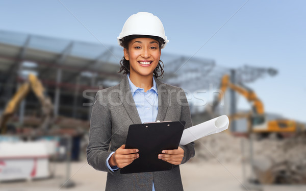 Glimlachend architect helm blauwdruk gebouw ontwikkelen Stockfoto © dolgachov