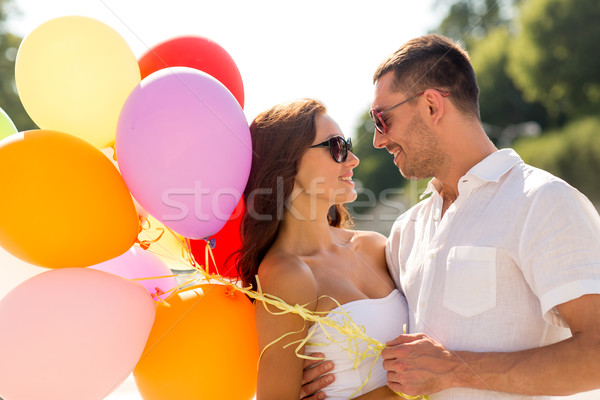 smiling couple in city Stock photo © dolgachov