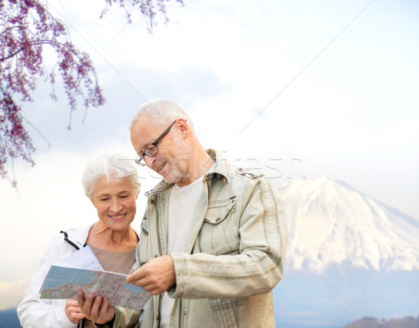 Heureux couple de personnes âgées Voyage carte montagnes famille [[stock_photo]] © dolgachov