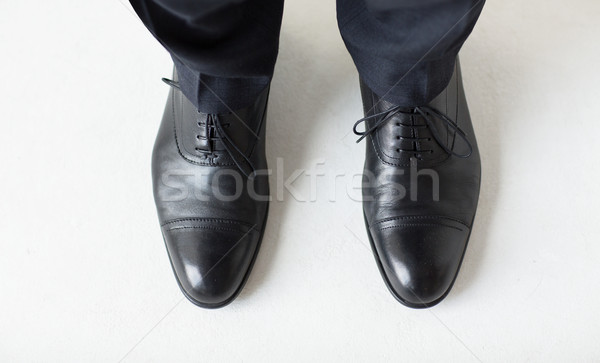 close up of man legs in elegant shoes with laces Stock photo © dolgachov