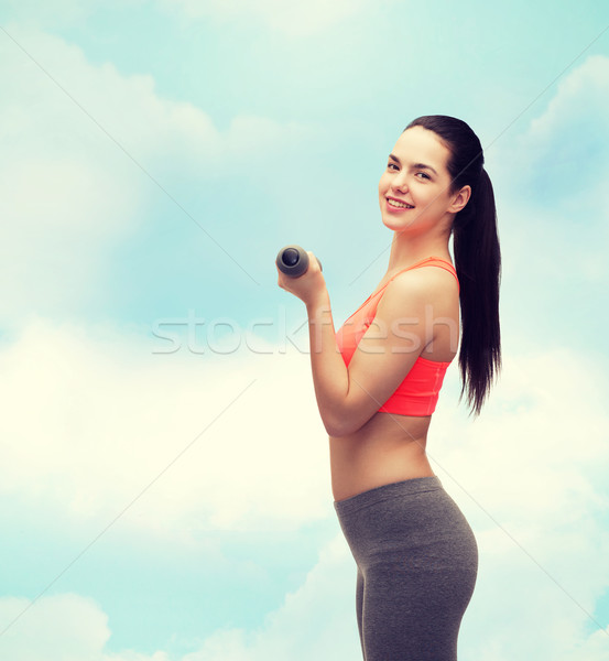 Jóvenes deportivo mujer luz pesas deporte Foto stock © dolgachov