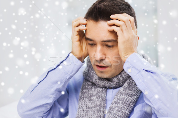 close up of ill man with flu and headache at home Stock photo © dolgachov