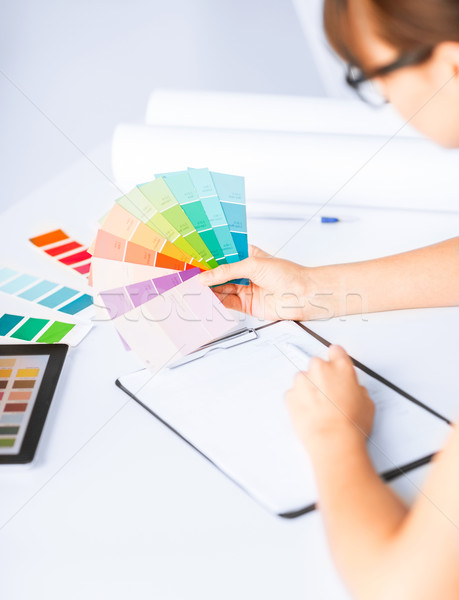 woman working with color samples for selection Stock photo © dolgachov