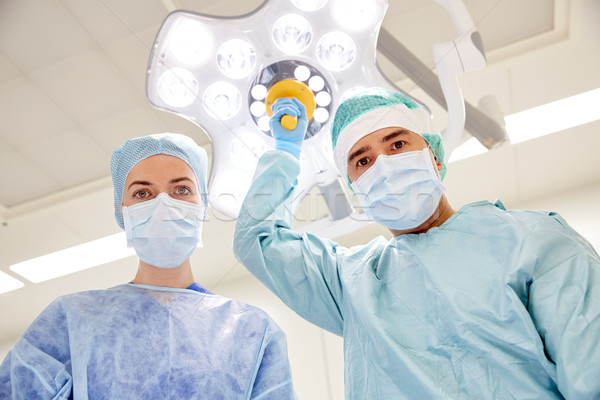 group of surgeons in operating room at hospital Stock photo © dolgachov