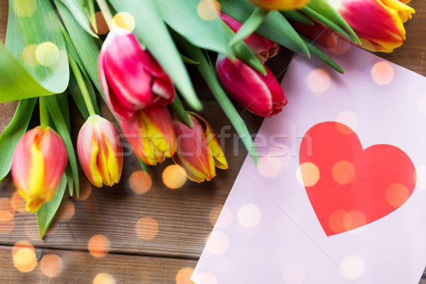 close up of flowers and greeting card with heart Stock photo © dolgachov