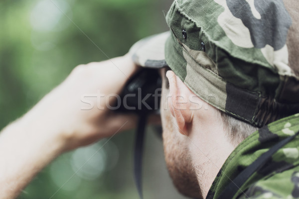 close up of soldier or hunter with binocular Stock photo © dolgachov