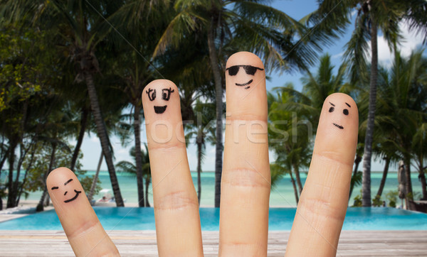 close up of fingers with smiley faces on beach Stock photo © dolgachov