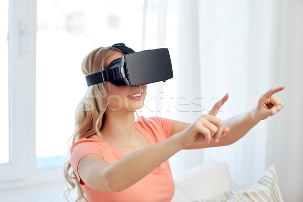 Stock photo: woman in virtual reality headset or 3d glasses