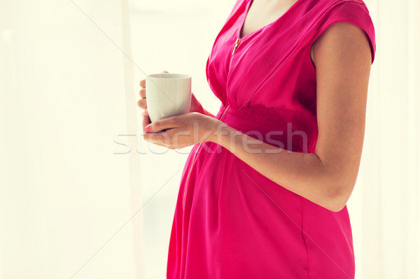 Donna incinta Cup bere tè home gravidanza Foto d'archivio © dolgachov