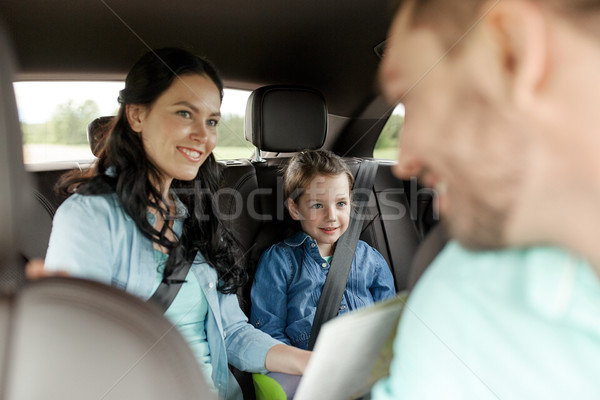happy family with travel map driving in car Stock photo © dolgachov