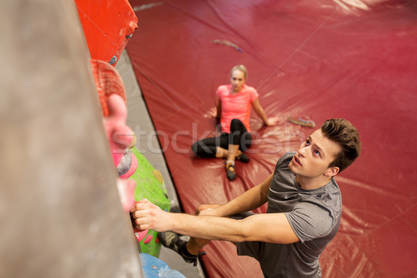 man and woman exercising at indoor climbing gym Stock photo © dolgachov