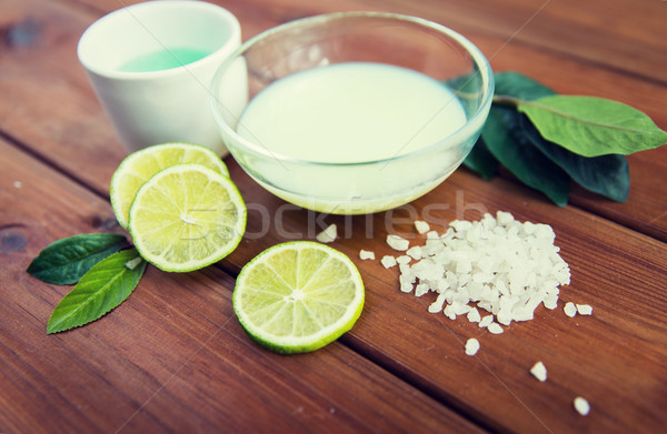 close up of body lotion, cream and salt on wood Stock photo © dolgachov